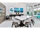 Open community room features large table, seating, and stylish decor for gatherings at 7773 Spectrum Dr, Reunion, FL 34747