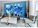 Modern living room featuring blue accent wall and contemporary furniture at 7773 Spectrum Dr, Reunion, FL 34747