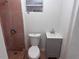 Cozy bathroom featuring a tiled shower and updated vanity with a sink at 822 5Th St, Orlando, FL 32824