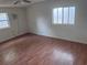 A clean bedroom with updated floors and a ceiling fan, providing a calm atmosphere at 822 5Th St, Orlando, FL 32824