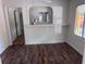 Dining room with updated floors, bright walls, and a passthrough to another room at 822 5Th St, Orlando, FL 32824