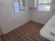 A bright room showcasing updated flooring and clean white walls at 822 5Th St, Orlando, FL 32824