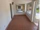 Enclosed porch featuring tile flooring and sliding glass windows at 822 5Th St, Orlando, FL 32824