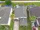 Aerial view showcasing the home's layout, private pool, and landscaping in a peaceful, Gathering-friendly neighborhood at 824 Bloomingdale Dr, Davenport, FL 33897
