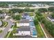 Overhead view of backyards with screened pools, solar panels, green lawns, and privacy fences at 824 Bloomingdale Dr, Davenport, FL 33897