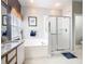 Bright bathroom with a garden tub, walk-in shower, and granite countertops at 824 Bloomingdale Dr, Davenport, FL 33897