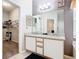 Bathroom featuring a double vanity, granite countertops, and walk-in closet at 824 Bloomingdale Dr, Davenport, FL 33897