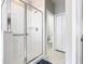 Bathroom showcasing a glass-enclosed shower, toilet, and closet at 824 Bloomingdale Dr, Davenport, FL 33897