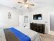 Bedroom with ceiling fan, dresser, and ensuite bathroom at 824 Bloomingdale Dr, Davenport, FL 33897