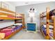 ' bedroom featuring wooden bunk beds, a nightstand with drawers, and playful decor at 824 Bloomingdale Dr, Davenport, FL 33897