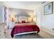 Comfortable bedroom featuring a queen bed, bedside tables, and a neutral color scheme at 824 Bloomingdale Dr, Davenport, FL 33897
