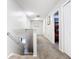 Well-lit hallway with carpeted flooring and access to multiple rooms at 824 Bloomingdale Dr, Davenport, FL 33897