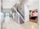 Spacious hallway with tiled flooring, leading to the living area and a bedroom at 824 Bloomingdale Dr, Davenport, FL 33897