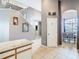 Hallway near stairway leading to dining area, tiled flooring at 824 Bloomingdale Dr, Davenport, FL 33897