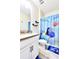 Bright bathroom featuring a single sink vanity with a Finding Nemo themed shower curtain at 8974 Cabot Cliffs Dr, Davenport, FL 33896