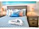 Comfortable bedroom with a serene atmosphere, beach-themed decor, and soft lighting at 8974 Cabot Cliffs Dr, Davenport, FL 33896