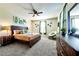 Relaxing bedroom with a wooden headboard, green accents, and cozy furnishings at 8974 Cabot Cliffs Dr, Davenport, FL 33896