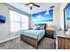 Cozy bedroom featuring a comfortable bed, beach-themed decor, and ample natural light at 8974 Cabot Cliffs Dr, Davenport, FL 33896