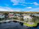 Lovely aerial view of lakeside neighborhood with colorful buildings, trees, and water views at 920 Spring Park St # 301, Celebration, FL 34747