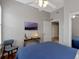 Bedroom featuring a ceiling fan, hardwood floors, and bright lighting at 920 Spring Park St # 301, Celebration, FL 34747