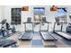 Well-equipped fitness center with treadmills, stationary bikes, and large windows for natural light at 920 Spring Park St # 301, Celebration, FL 34747