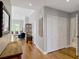Hallway with wood flooring, closet space, and access to a bathroom, combining utility and design at 920 Spring Park St # 301, Celebration, FL 34747