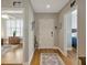 Entryway with wood floors, white door, and views into other rooms, blending style and functionality at 920 Spring Park St # 301, Celebration, FL 34747