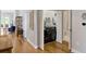 Hallway with laundry closet featuring modern washer/dryer and shelving, adding convenience at 920 Spring Park St # 301, Celebration, FL 34747