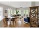 Open-concept living and dining area with hardwood floors, ample natural light, and stylish furnishings at 920 Spring Park St # 301, Celebration, FL 34747