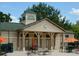 Exterior of the community pool house, featuring an open design, and space for relaxing by the pool at 920 Spring Park St # 301, Celebration, FL 34747
