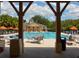 Framed view of the pool with lounge seating and umbrellas, offering a relaxing atmosphere for community members at 920 Spring Park St # 301, Celebration, FL 34747