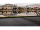 Stunning waterfront view reflecting the building's lights on the water in a lovely and peaceful city at 920 Spring Park St # 301, Celebration, FL 34747