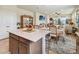 Open-concept kitchen island with a view of the dining area and living room at 1895 Spring Shower Cir, Kissimmee, FL 34744