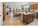 Spacious, open concept living and dining area featuring tiled floors and natural light from rear glass doors at 1895 Spring Shower Cir, Kissimmee, FL 34744