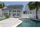 Relaxing backyard features a private pool, patio area, and lush landscaping, creating an ideal outdoor retreat at 1236 Aquila Loop, Celebration, FL 34747