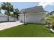 Charming backyard features artificial turf, and a basketball hoop, ideal for outdoor activities and entertainment at 1236 Aquila Loop, Celebration, FL 34747