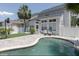Private backyard featuring a sparkling pool, paver patio, and well-maintained landscaping at 1236 Aquila Loop, Celebration, FL 34747