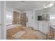 Bathroom featuring a soaking tub, glass enclosed shower, white vanity, and tile flooring at 1236 Aquila Loop, Celebration, FL 34747