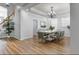 Elegant dining room featuring stylish furniture, modern lighting, and hardwood floors at 1236 Aquila Loop, Celebration, FL 34747