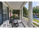 Comfortable front porch with seating, offering a relaxing outdoor space overlooking the neighborhood at 1236 Aquila Loop, Celebration, FL 34747