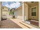 Private outdoor brick patio featuring white fence and outdoor seating, great for relaxing or entertaining guests at 1592 Castile St, Celebration, FL 34747