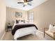 Comfortable bedroom with a cozy bed, neutral walls, carpet flooring and natural light from a window at 1592 Castile St, Celebration, FL 34747
