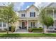 Charming two-story home with a welcoming front porch and well-manicured landscaping at 1592 Castile St, Celebration, FL 34747