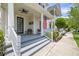 Inviting front porch with ceiling fans and comfortable seating area at 1592 Castile St, Celebration, FL 34747