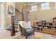 Cozy living room features a leather armchair, stylish decor, and a staircase, perfect for relaxation at 1592 Castile St, Celebration, FL 34747