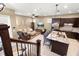 Open-concept living room and kitchen feature a spacious design with modern appliances and granite countertops at 1592 Castile St, Celebration, FL 34747