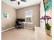 Practical office with a desk, office chair, and natural light creates a versatile workspace at 1592 Castile St, Celebration, FL 34747