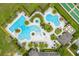 Beautiful aerial view showcasing the community pool, jacuzzi, and bocce ball and shuffleboard courts at 1598 Whitewood Ct, Kissimmee, FL 34747