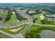 Community aerial view of single Gathering homes close to golf course and lakes at 1598 Whitewood Ct, Kissimmee, FL 34747