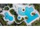 Overhead aerial shot of the community pool with lounge chairs and many seating areas at 1598 Whitewood Ct, Kissimmee, FL 34747